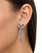 Pair of diamond earrings on a white background