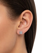 Close-up of an ear wearing a square diamond earring