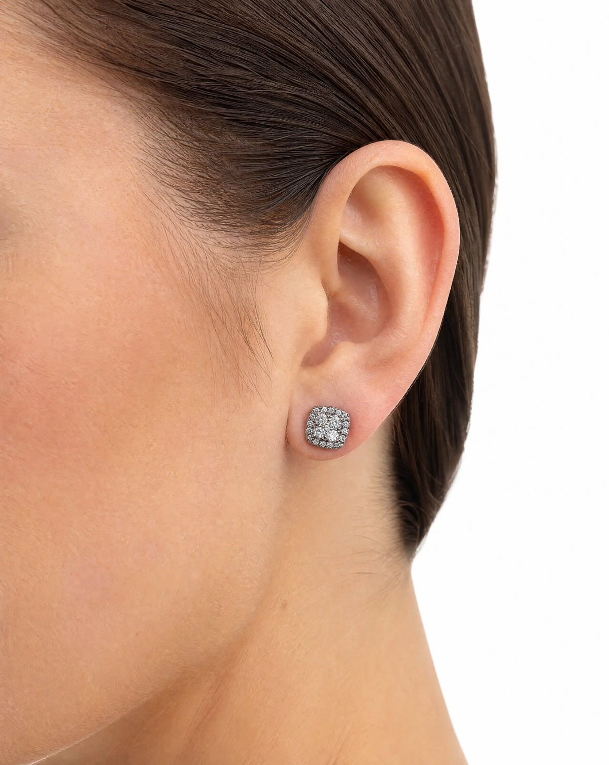 Close-up of an ear wearing a sparkling earring 