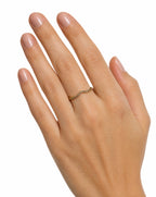 Hand wearing a gold ring 