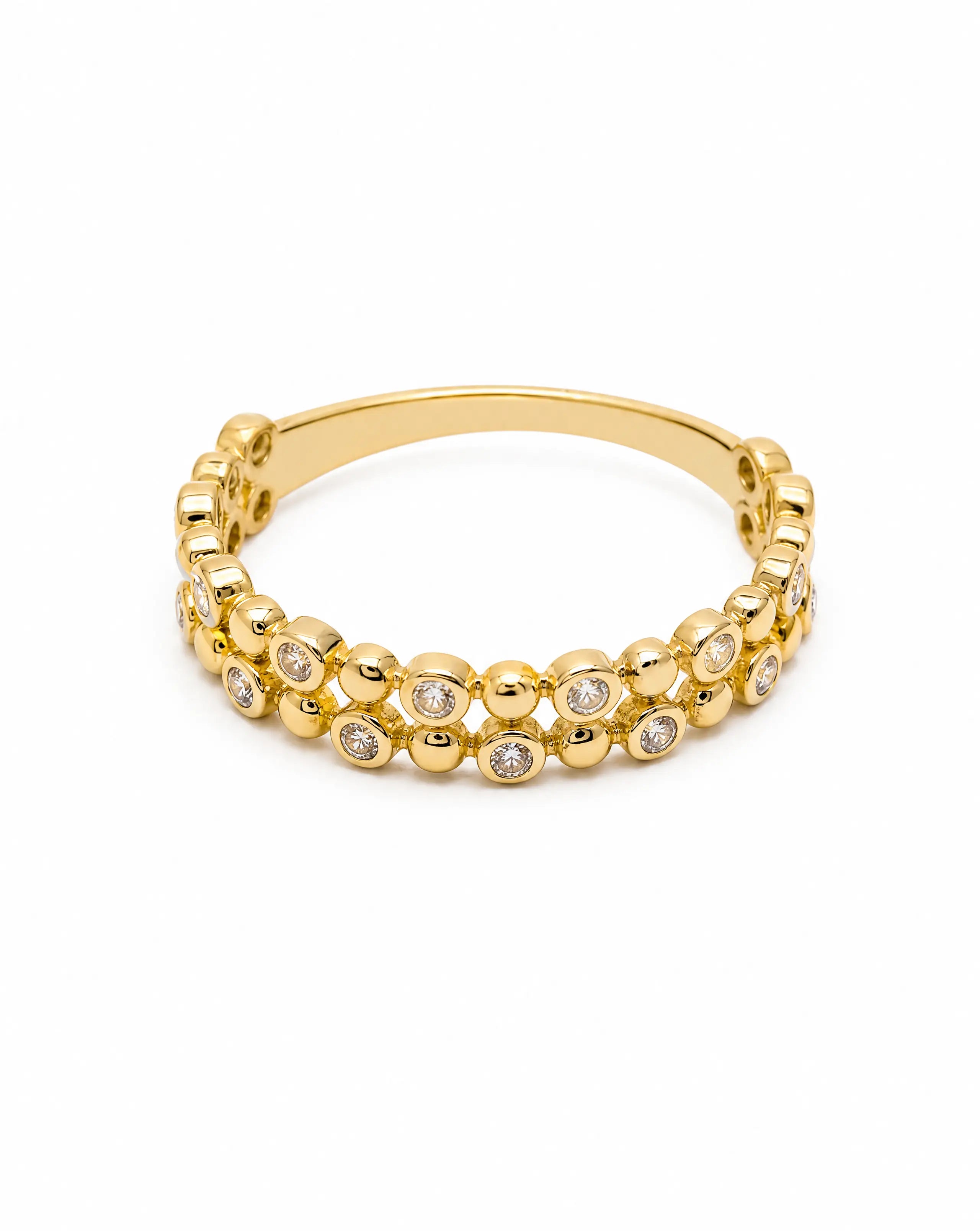 Gold bracelet with embedded stones on a white background
