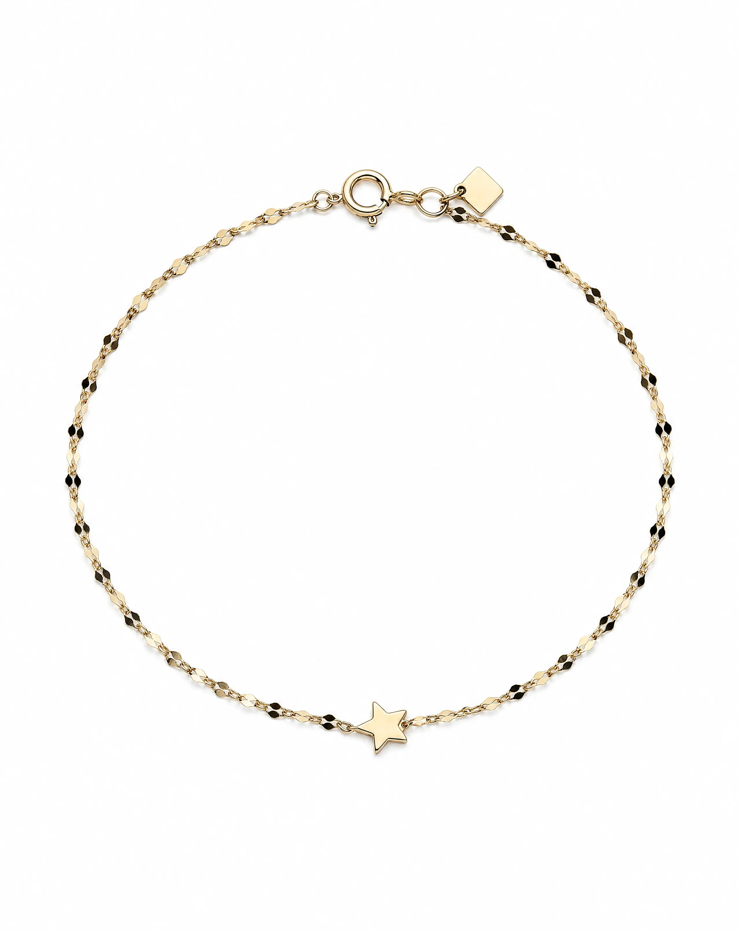 Gold bracelet with star charm on a white background
